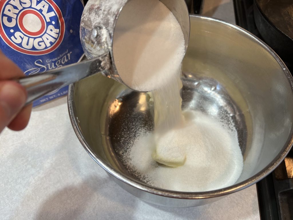 pouring sugar into bowl