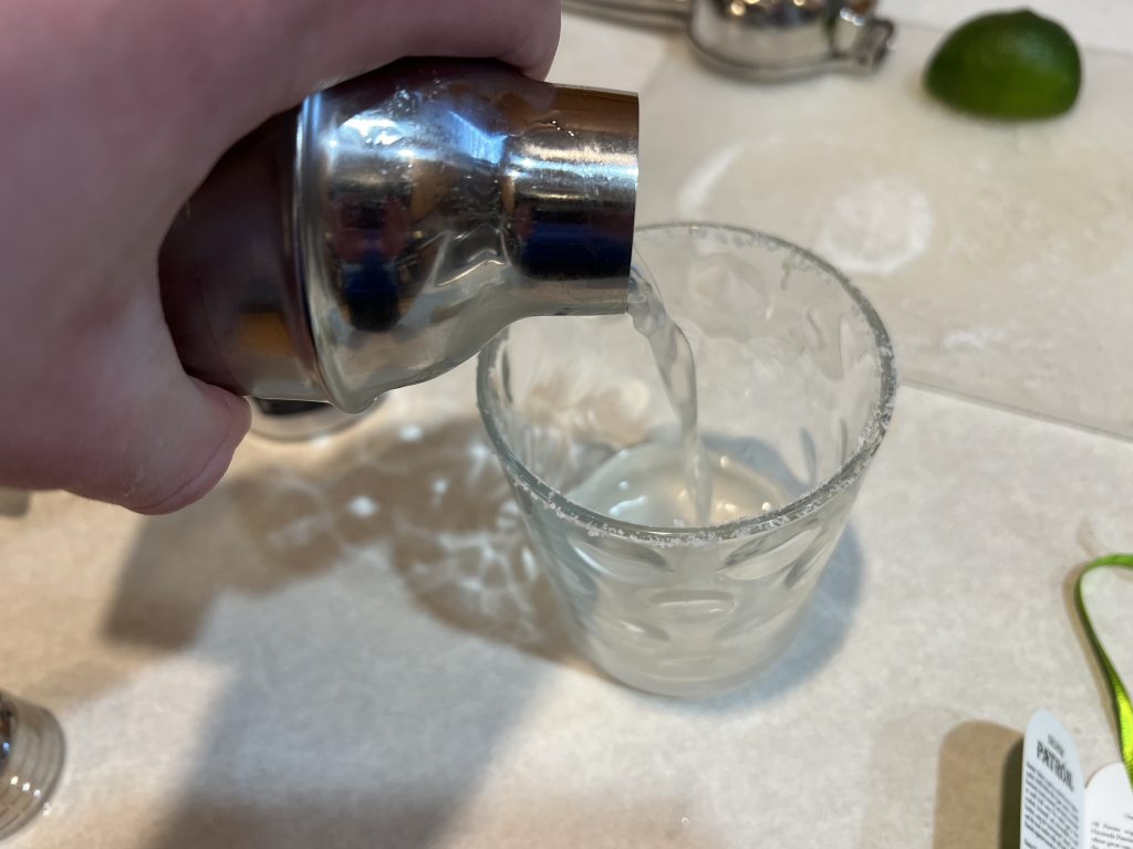 pouring drink into glass