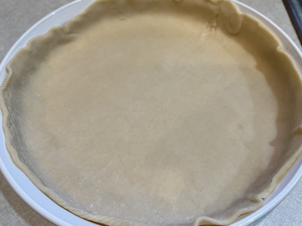 dough in plate for quiche recipe