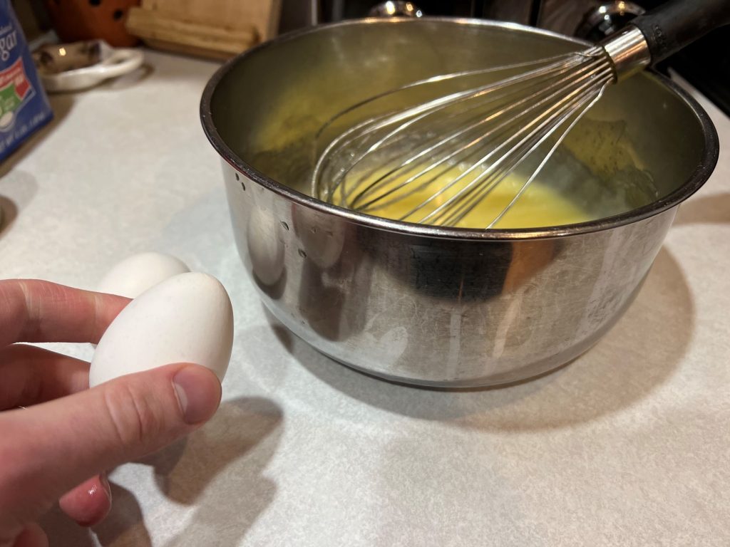 putting egg into cookie mix