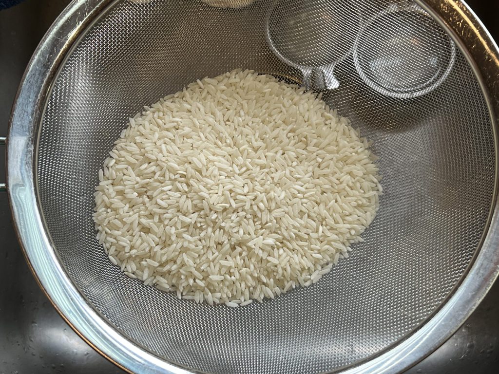 rice in mesh strainer 