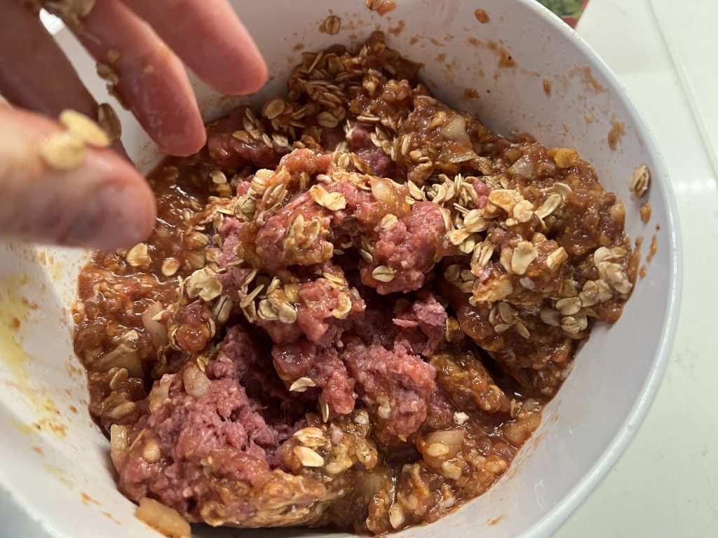 mixing meatloaf ingredients