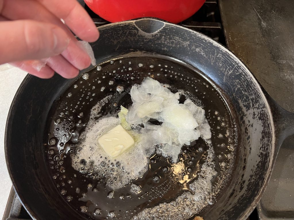 butter and onions in the skillet
