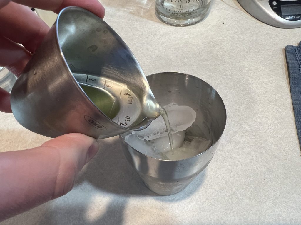 pouring limoncello into shaker