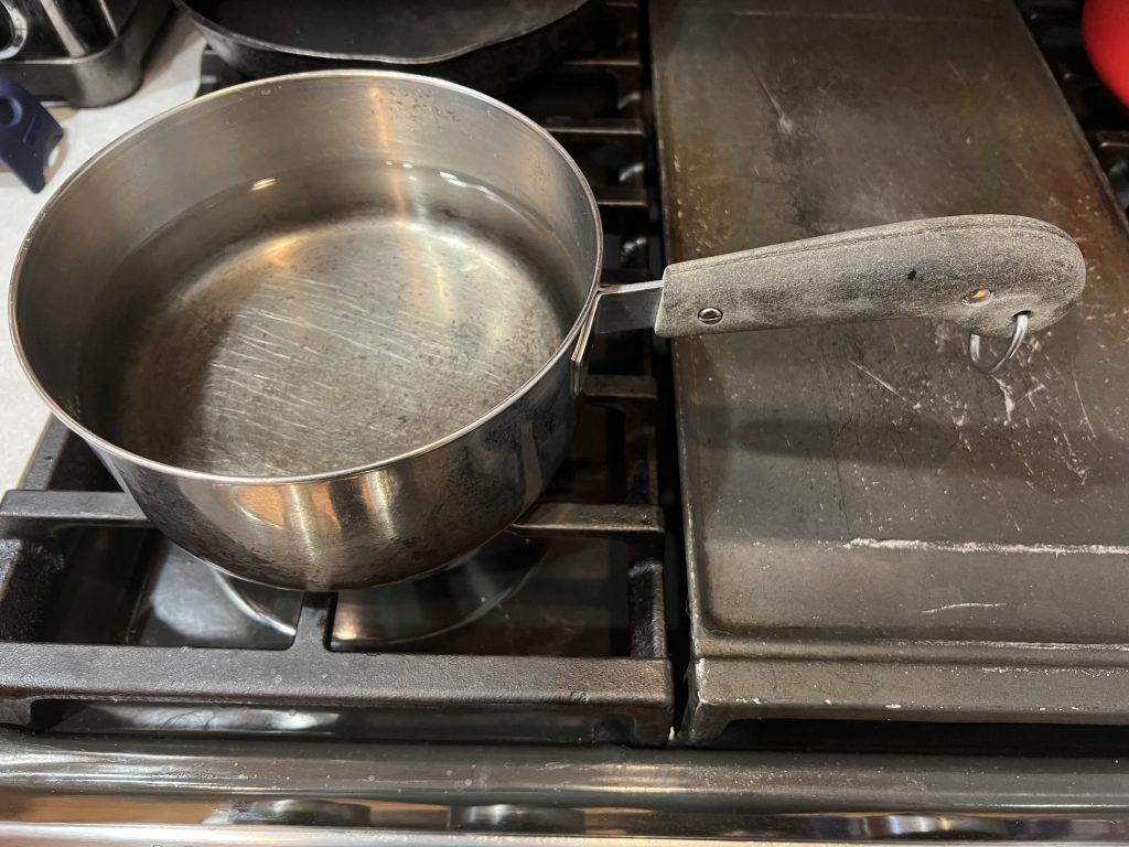 saucepan with water for hard boiling eggs