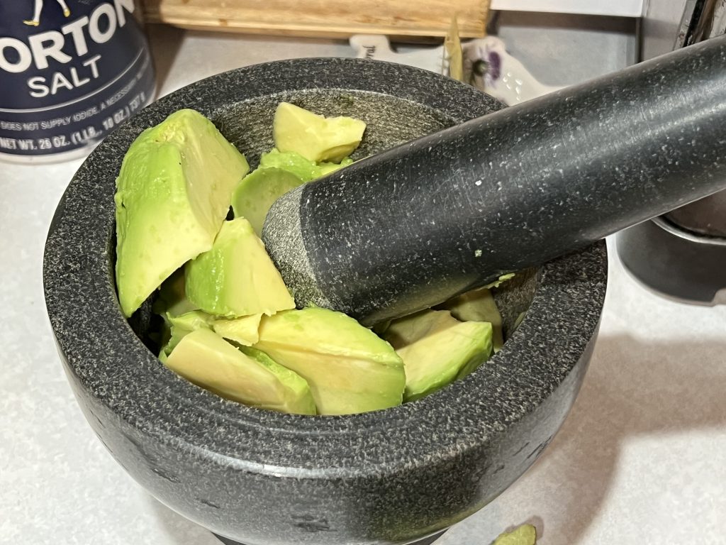 avocado in a mortar bowl