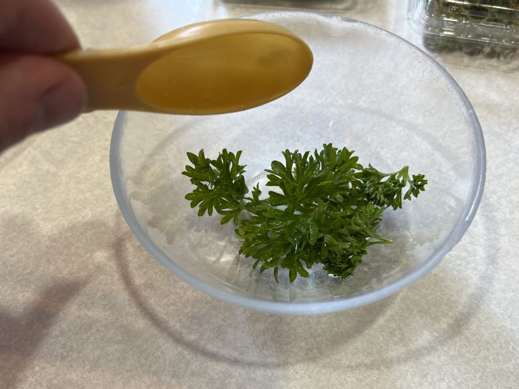 parsley in bowl for cavatappi pasta recipe