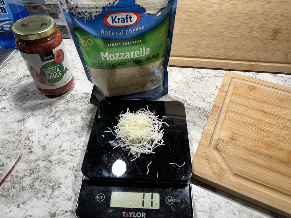 mozzarella cheese on a kitchen scale