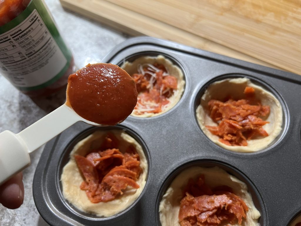 muffin cups with ingredients in them