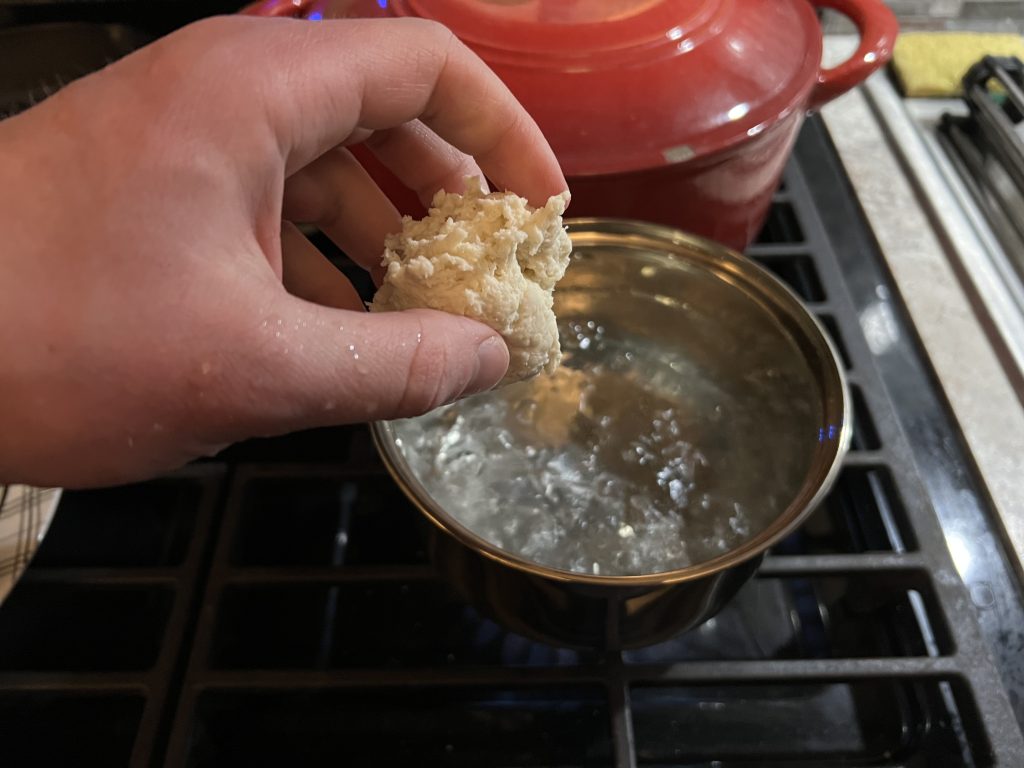 putting dumpling in boiling water