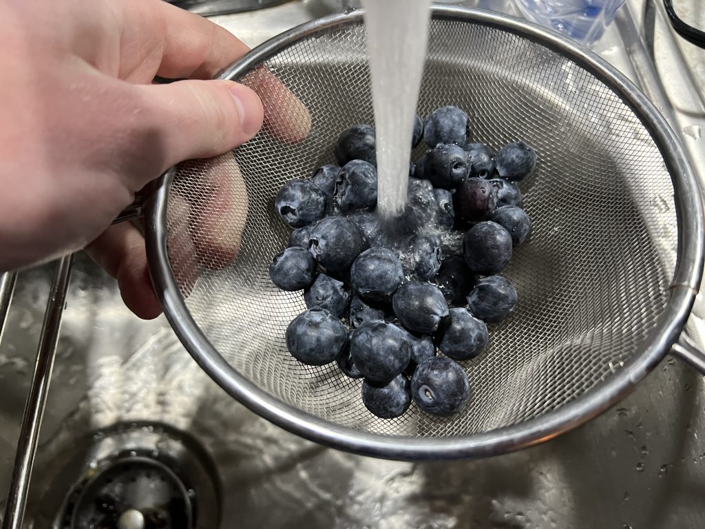 blueberries in mesh strainer