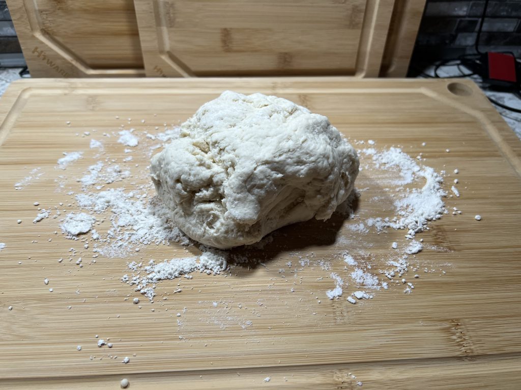ball of dough on work surface for biscuit recipe