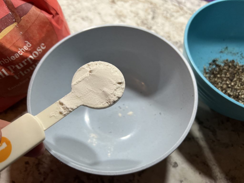 measuring flour for chicken alfredo recipe