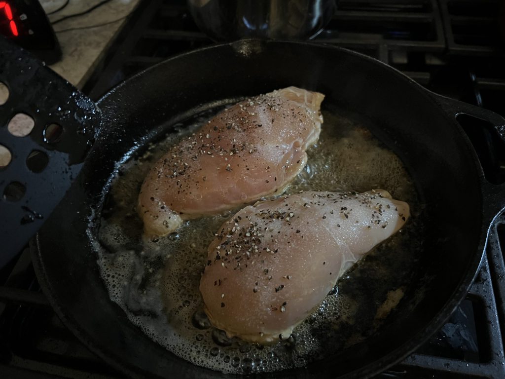 chicken breasts in a skillet