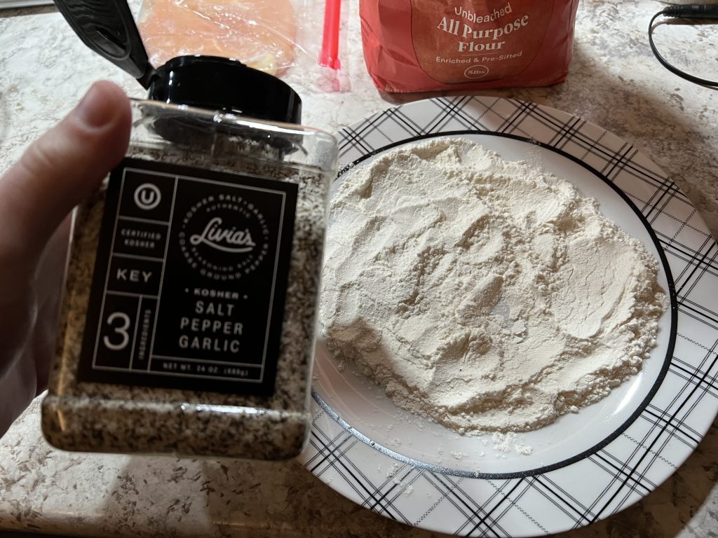 salt and peppering the flour